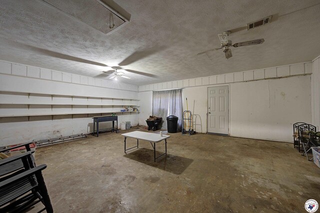interior space featuring visible vents and ceiling fan