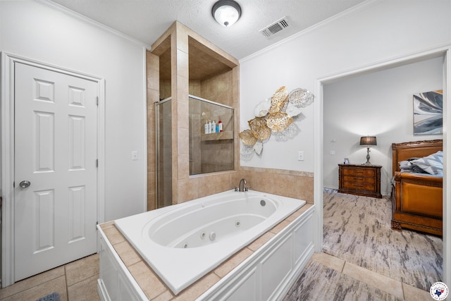 215 Hunters Cv, Texarkana, TX 75503 - bathroom featuring a stall shower, crown molding, tile patterned flooring, a whirlpool tub, and ensuite bath