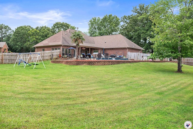 215 Hunters Cv, Texarkana, TX 75503 - view of yard featuring a playground and a patio