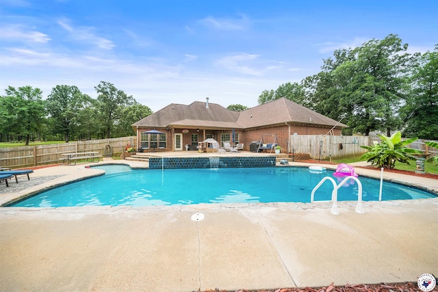 215 Hunters Cv, Texarkana, TX 75503 - view of swimming pool with a patio area and a fenced backyard