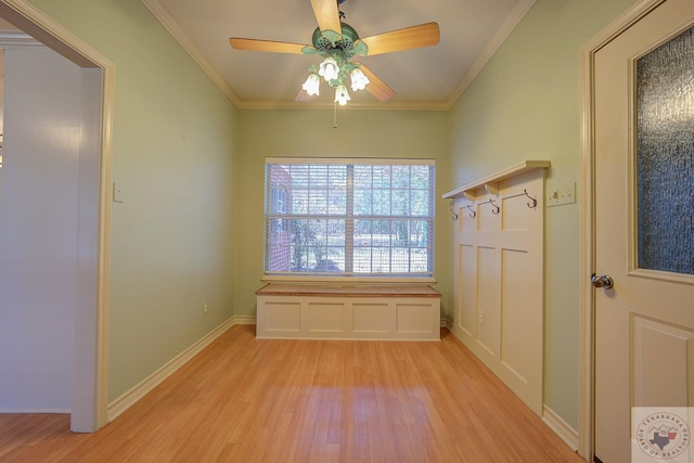 unfurnished room featuring crown molding, light wood-type flooring, and ceiling fan