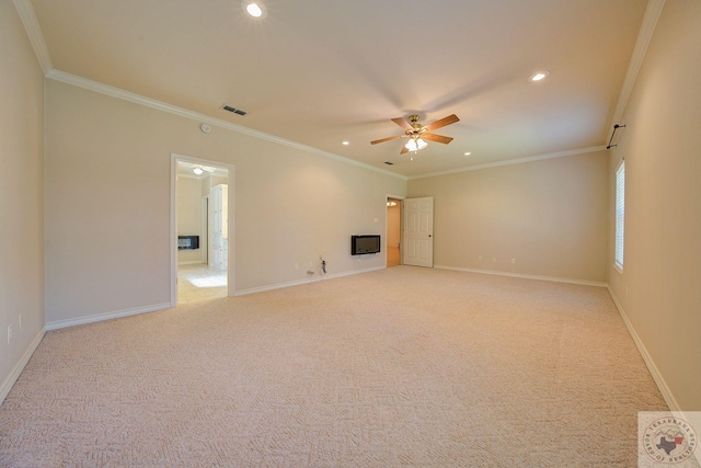 spare room with light colored carpet and ornamental molding