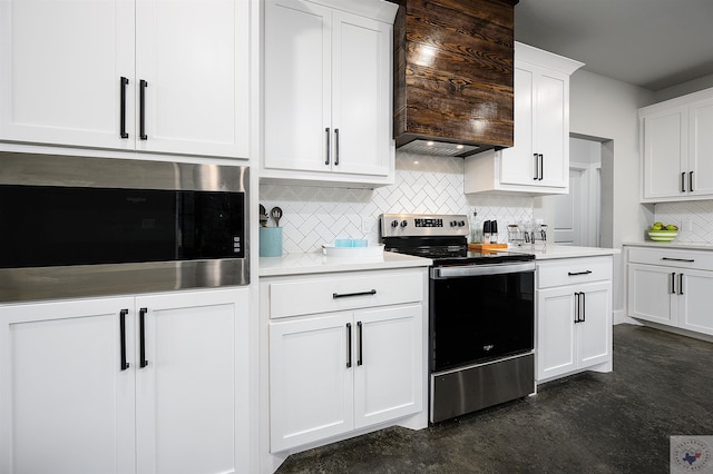 kitchen with premium range hood, backsplash, white cabinetry, and stainless steel appliances