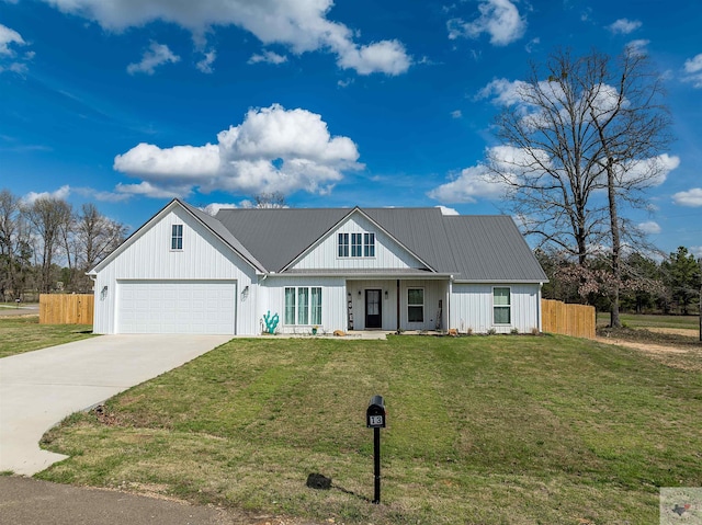 modern farmhouse featuring a garage and a front lawn