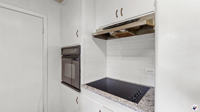 119 Hall St, New Boston, TX 75570 - kitchen featuring black appliances, under cabinet range hood, tasteful backsplash, and white cabinets