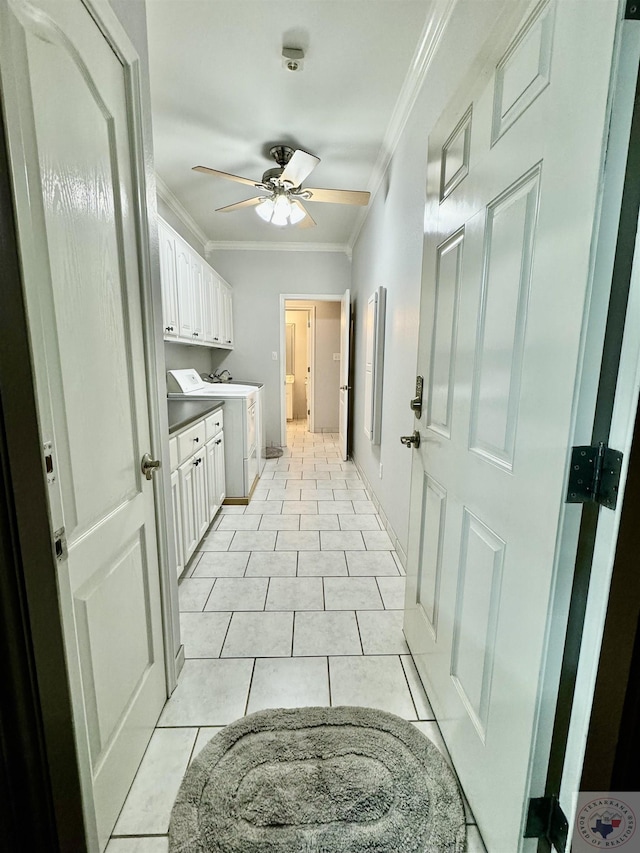 interior space featuring light tile patterned floors, ceiling fan, ornamental molding, and washer / clothes dryer