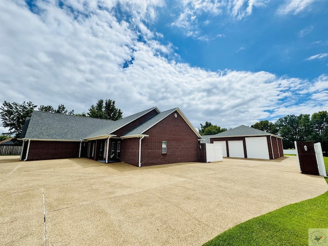 view of property exterior featuring an outbuilding and a garage