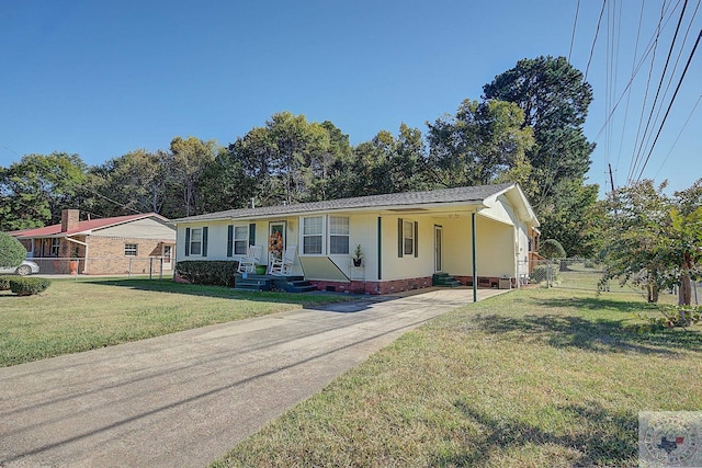 ranch-style home with a front yard