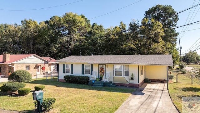 single story home featuring a front lawn