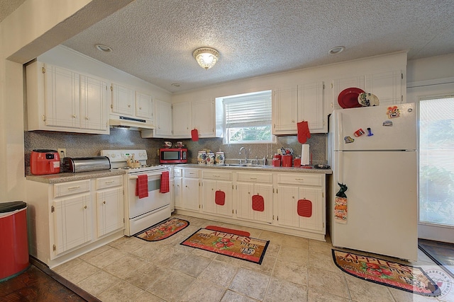 kitchen with sink, white cabinetry, white appliances, and decorative backsplash