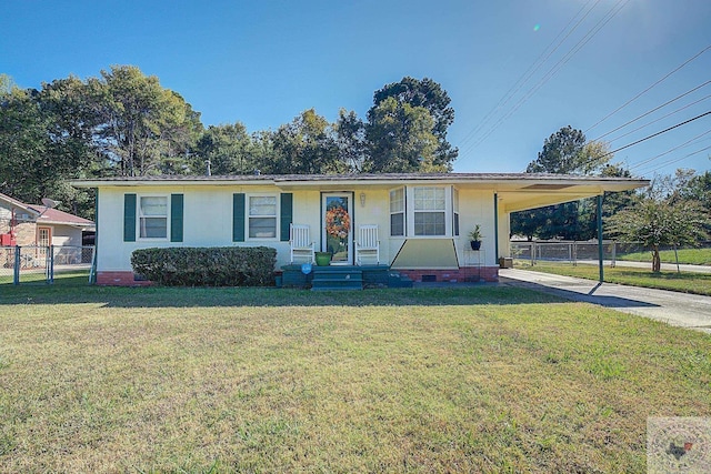 view of front facade with a front lawn and a carport