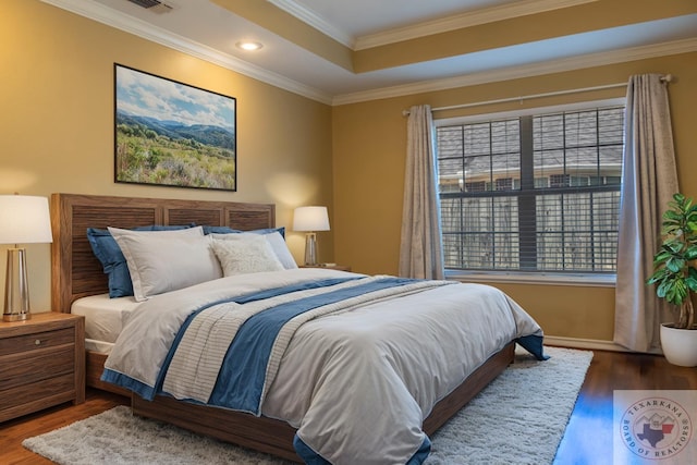 bedroom featuring crown molding and hardwood / wood-style floors