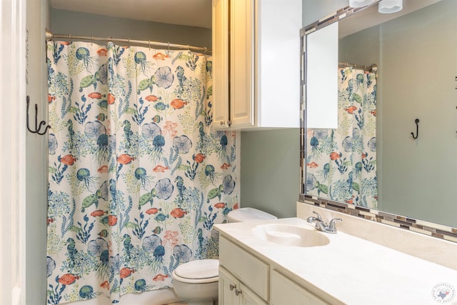 bathroom with vanity, toilet, and a shower with curtain