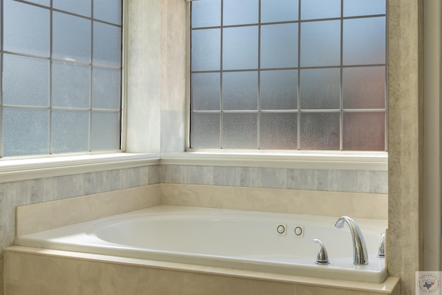 bathroom with tiled tub