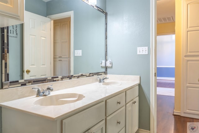 bathroom featuring vanity and hardwood / wood-style flooring