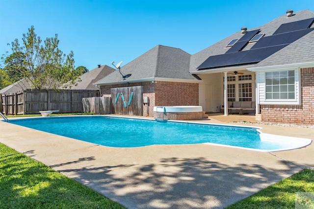 view of swimming pool with a patio area and french doors