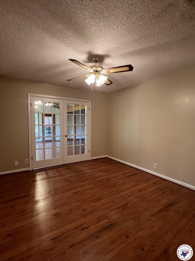6 Arnold Dr, Texarkana, AR 71854 - unfurnished room featuring dark wood finished floors, a ceiling fan, baseboards, and a textured ceiling