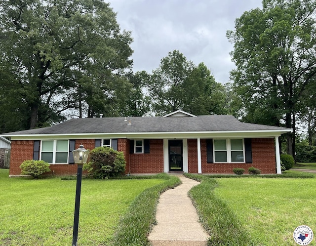 6 Arnold Dr, Texarkana, AR 71854 - ranch-style house with a front lawn, brick siding, and roof with shingles