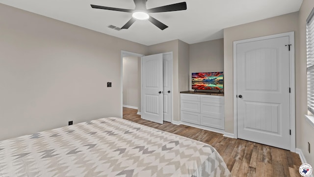 228 Old Factory Site Rd, Murfreesboro, AR 71958 - bedroom with wood finished floors, baseboards, and a ceiling fan