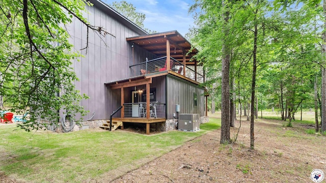 228 Old Factory Site Rd, Murfreesboro, AR 71958 - back of house with a balcony, central AC unit, a lawn, and a wooden deck