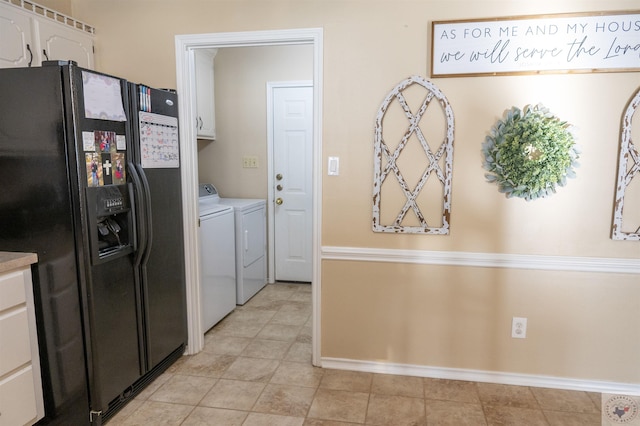 laundry area featuring cabinets and washing machine and dryer