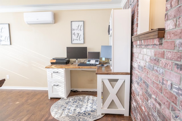 home office with an AC wall unit, dark wood-type flooring, brick wall, and crown molding