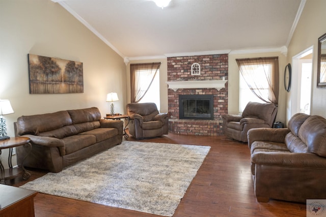 living room featuring a wealth of natural light, a brick fireplace, dark hardwood / wood-style floors, and lofted ceiling