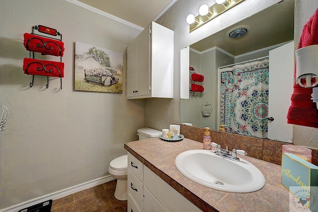 bathroom featuring toilet, vanity, and ornamental molding