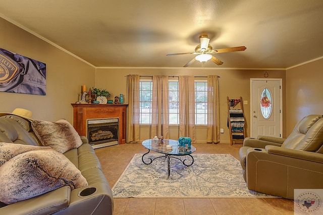 living room with ceiling fan, ornamental molding, and light tile patterned flooring