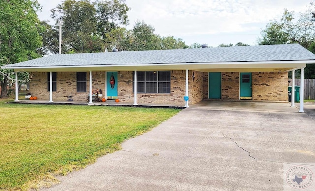 single story home featuring covered porch, a front yard, and a carport