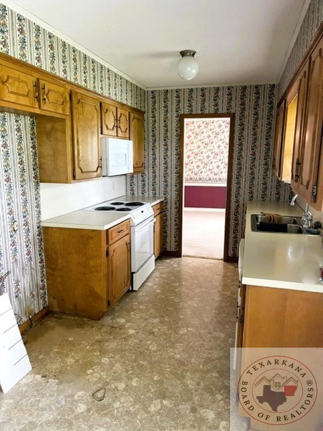 kitchen with sink and white appliances