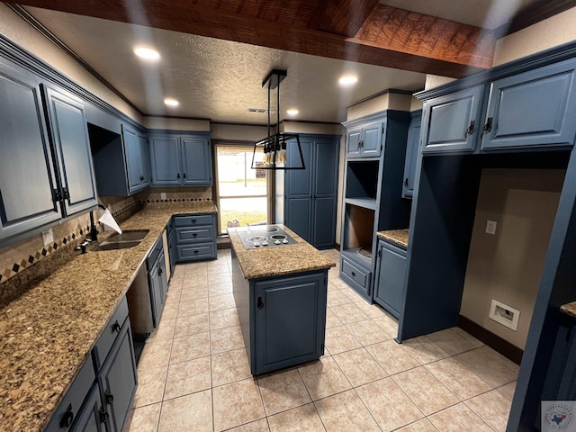 kitchen with pendant lighting, blue cabinets, light stone countertops, a kitchen island, and decorative backsplash