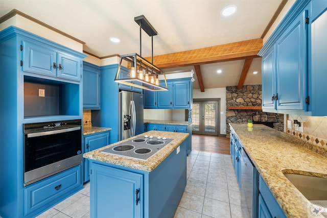 kitchen featuring a center island, blue cabinetry, stainless steel appliances, decorative backsplash, and beamed ceiling