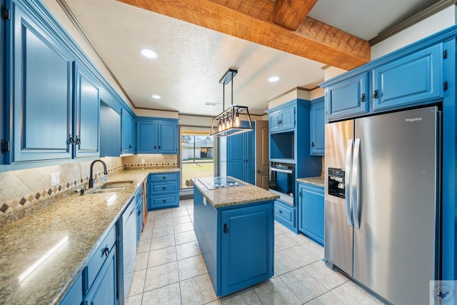 kitchen featuring blue cabinetry, stainless steel appliances, a sink, and a center island