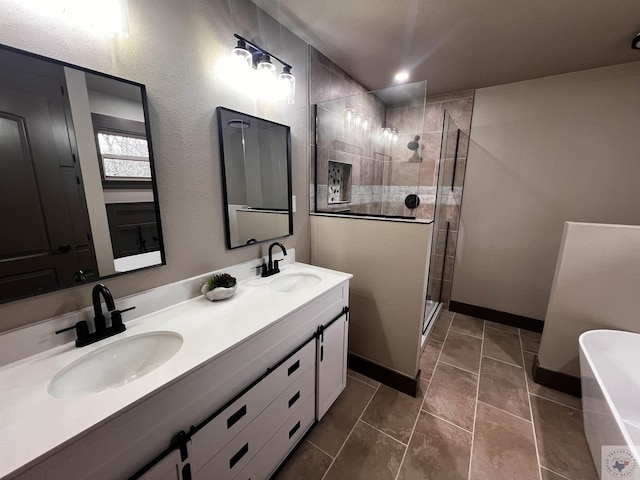 bathroom featuring vanity and shower with separate bathtub