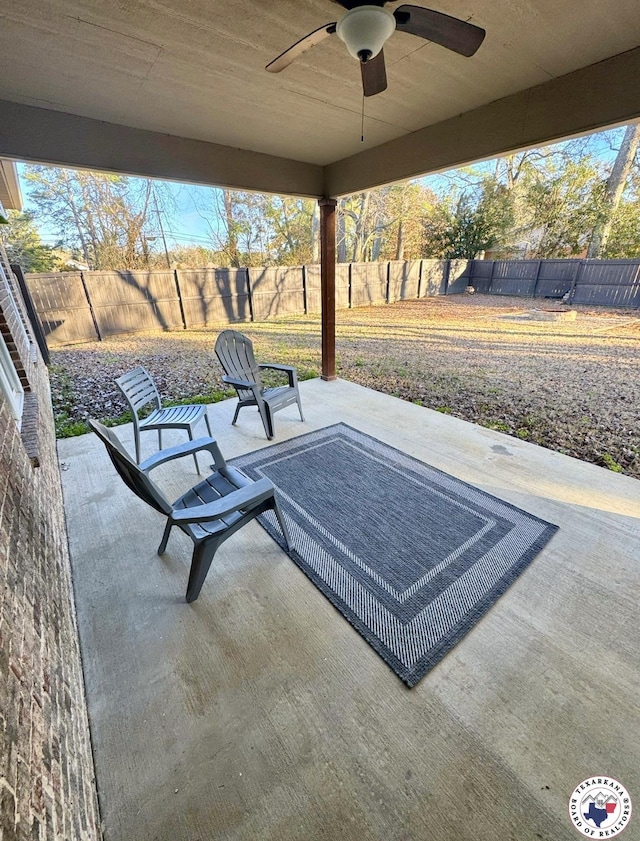 view of patio featuring a fenced backyard and a ceiling fan