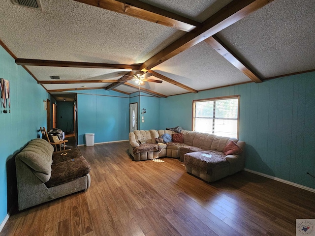 living room with wood-type flooring, lofted ceiling with beams, a textured ceiling, and ceiling fan