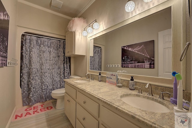 bathroom featuring crown molding, a shower with curtain, toilet, and vanity