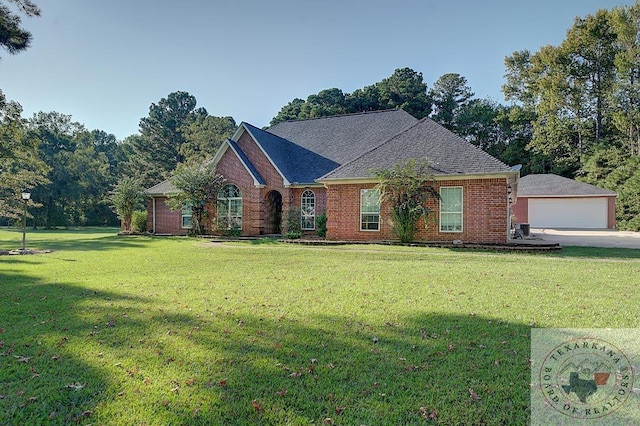 ranch-style house with a garage and a front yard