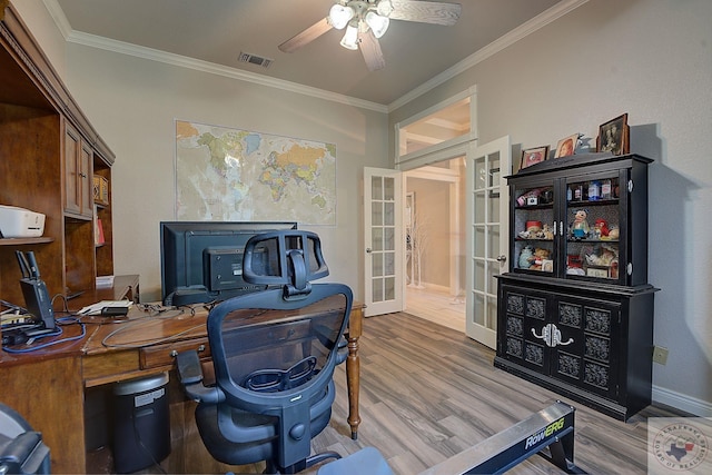 office space featuring ceiling fan, wood-type flooring, crown molding, and french doors