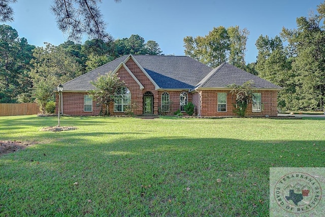 ranch-style house featuring a front lawn