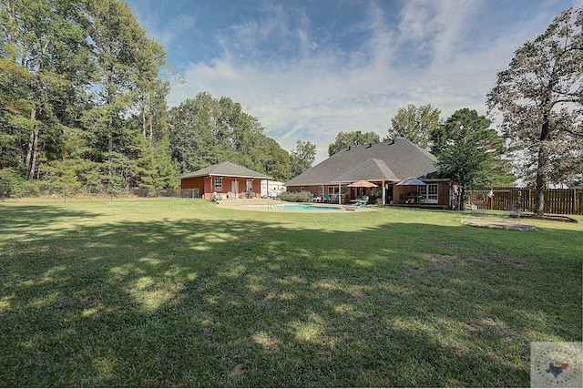 view of yard featuring a fenced in pool and a patio area