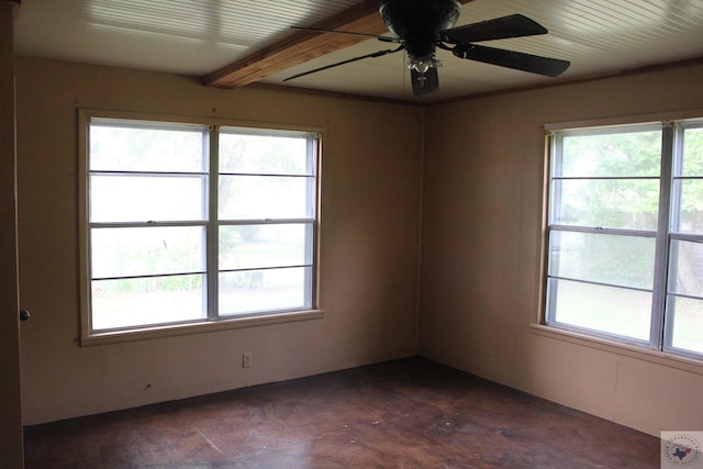 unfurnished room featuring beam ceiling