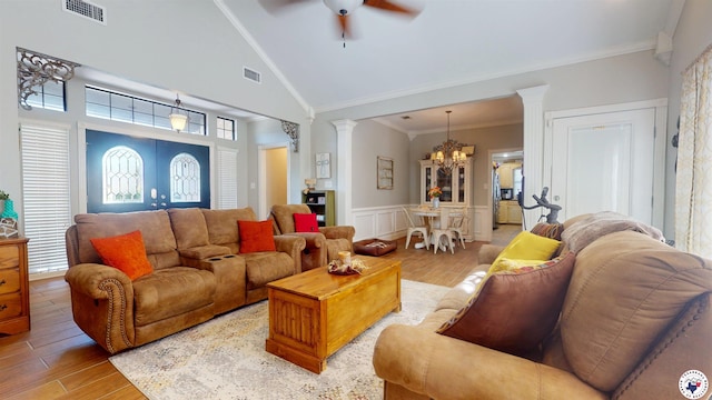 142 Corley Cir, Wake Village, TX 75501 - living room with ornate columns, a chandelier, light wood finished floors, a ceiling fan, and ornamental molding