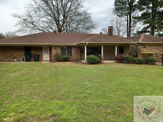 ranch-style home with a front lawn