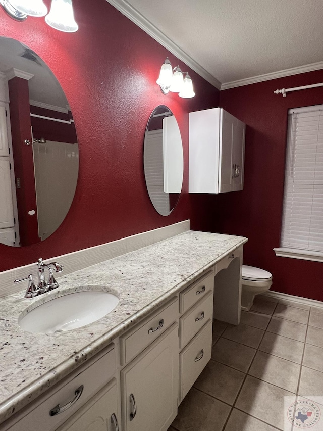 bathroom featuring tile patterned floors, vanity, ornamental molding, and toilet