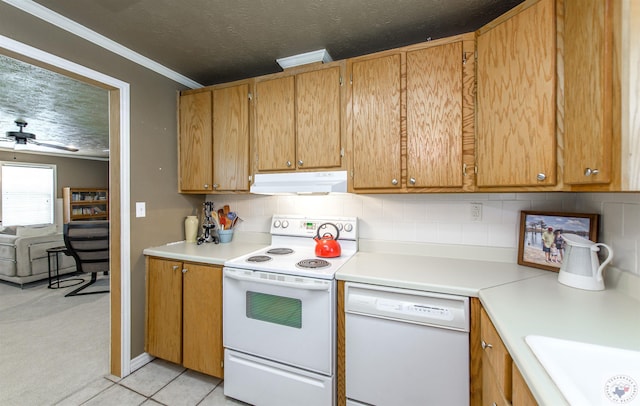 kitchen with white appliances, crown molding, tasteful backsplash, light tile patterned floors, and ceiling fan