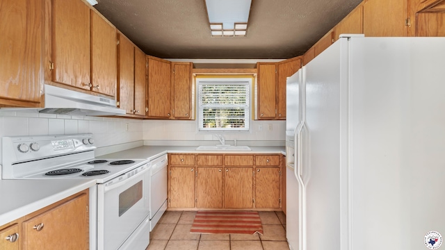 6616 Lakeridge Dr, Texarkana, TX 75503 - kitchen with white appliances, under cabinet range hood, light countertops, decorative backsplash, and light tile patterned floors
