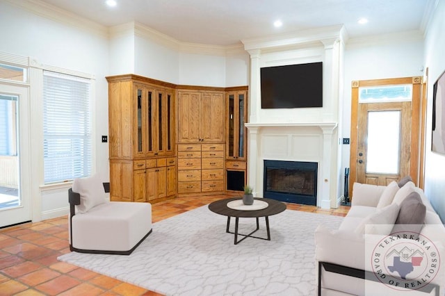 tiled living room with a healthy amount of sunlight and ornamental molding