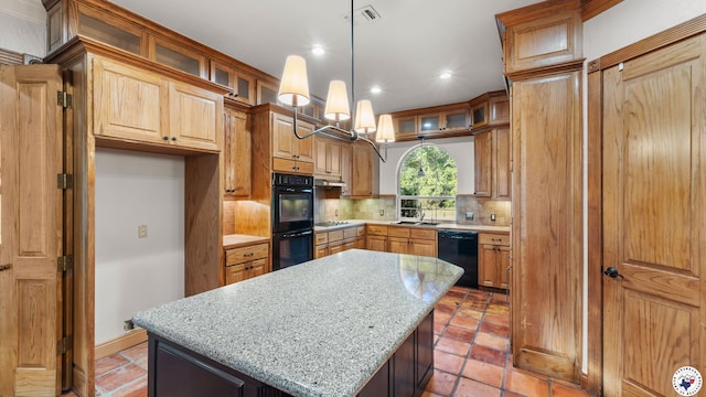 6616 Lakeridge Dr, Texarkana, TX 75503 - kitchen featuring black appliances, decorative backsplash, a center island, recessed lighting, and light stone counters